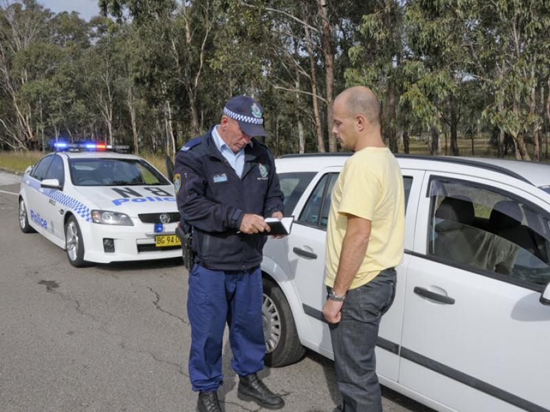 Police officer issuing a traffic offence fine